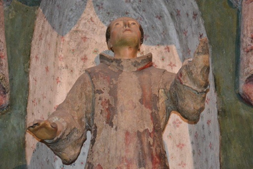 A statue gazing toward the heavens at San Xavier del Bac Mission, a historic Spanish Mission in Tucson, Arizona