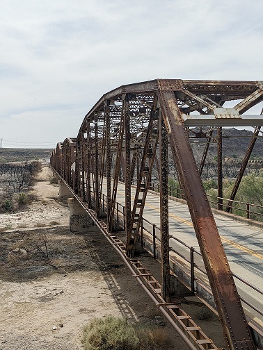 Old Steel Bridge Spans a Dry Desert Riverbed. Teach the tenets of your Christian faith by making faith relevant through conversations that span the chasm between your kids' material and spiritual lives.